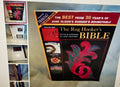 Book titled 'The Rug Hooker's Bible' with decorative cover on a textured surface.