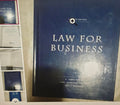 Book titled 'Law for Business' on a shelf with other books.