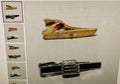 Collection of gold and silver tie clips on a light gray background