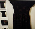 Close-up of a textured black fabric with a blurred background