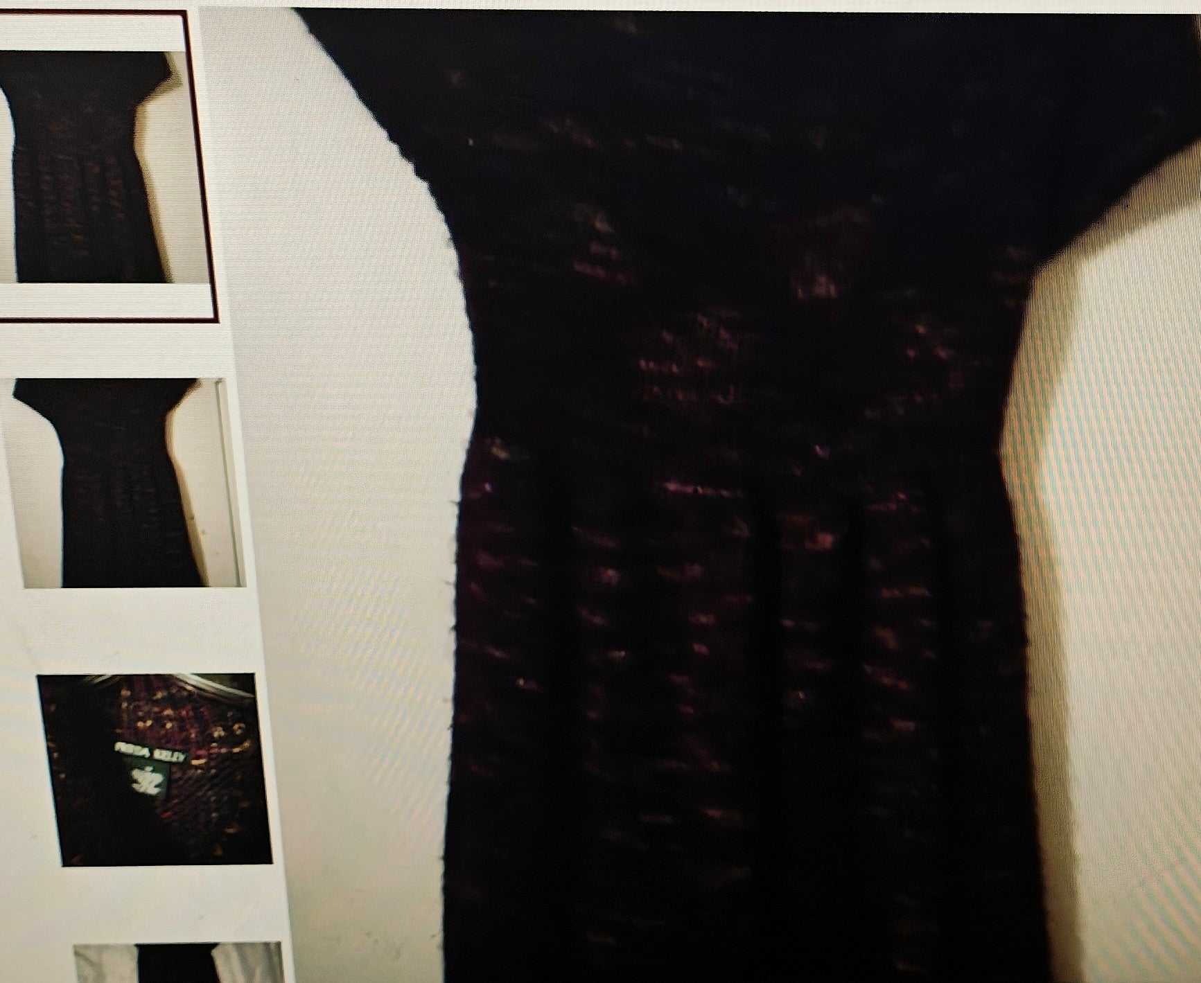 Close-up of a textured black fabric with a blurred background