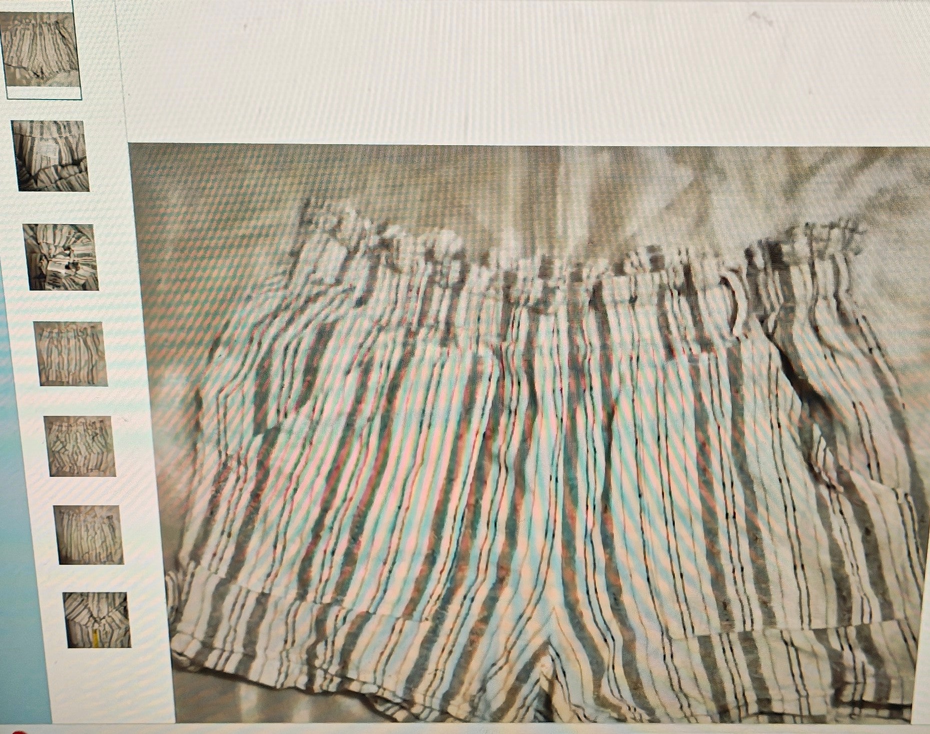 Striped shorts with a pattern of horizontal lines on a textured surface.