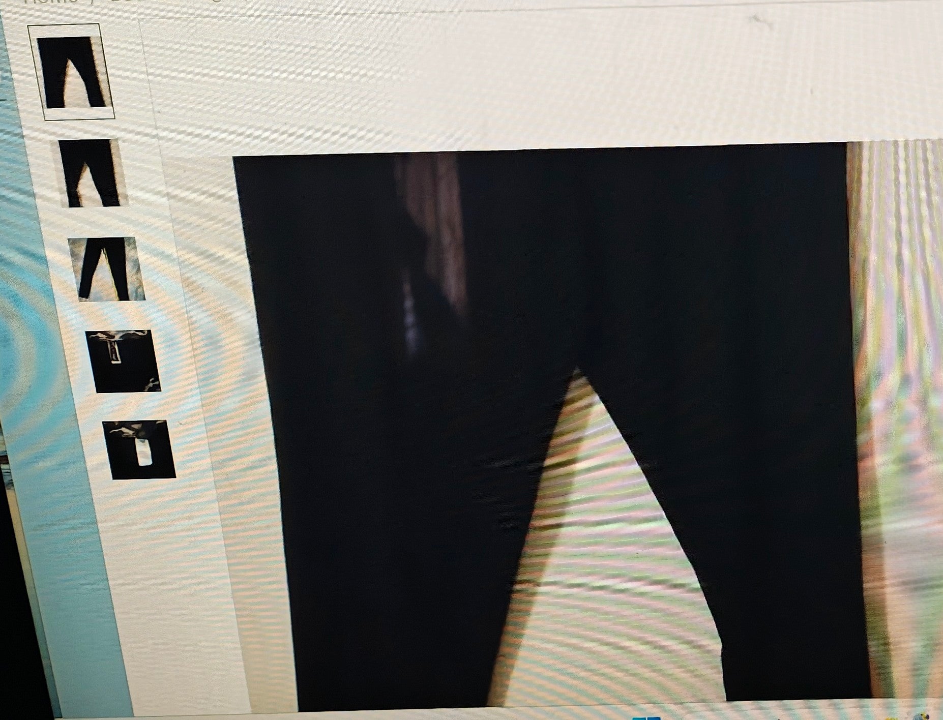 Black pants displayed on a mannequin with size chart on the left.