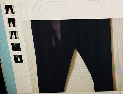 Black pants displayed on a mannequin with size chart on the left.