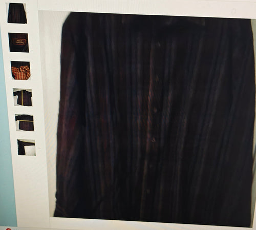 Dark shirt on a hanger with a white background