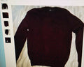Dark brown sweater on a light background