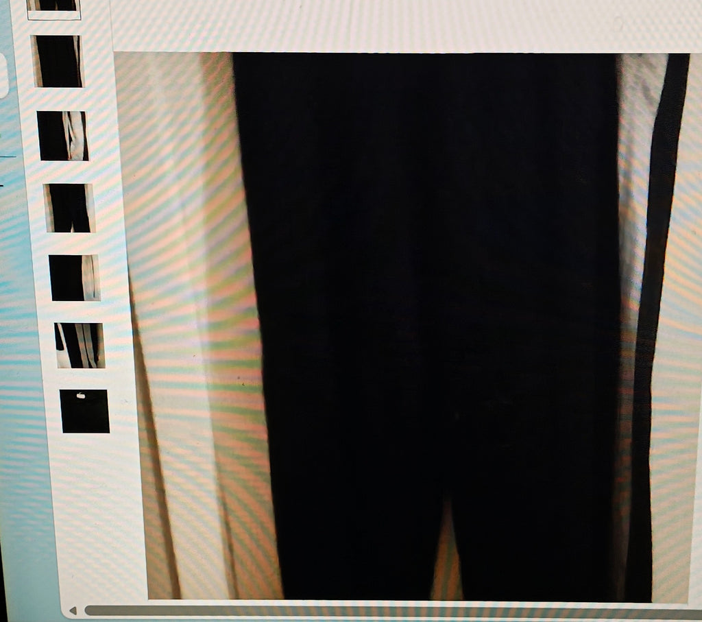 Close-up of a black fabric with a textured background