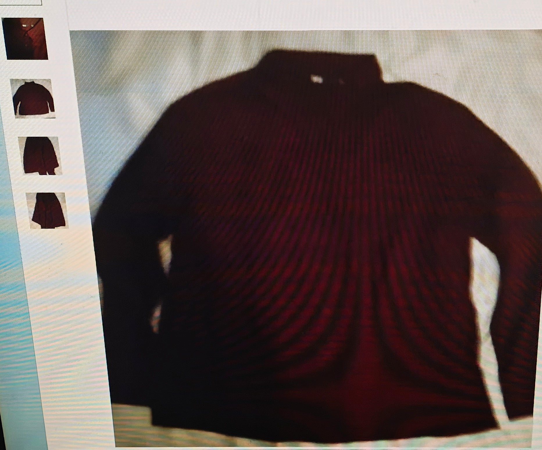 Dark red sweater on a light gray background
