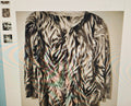 Zebra print jacket on a mannequin against a white background