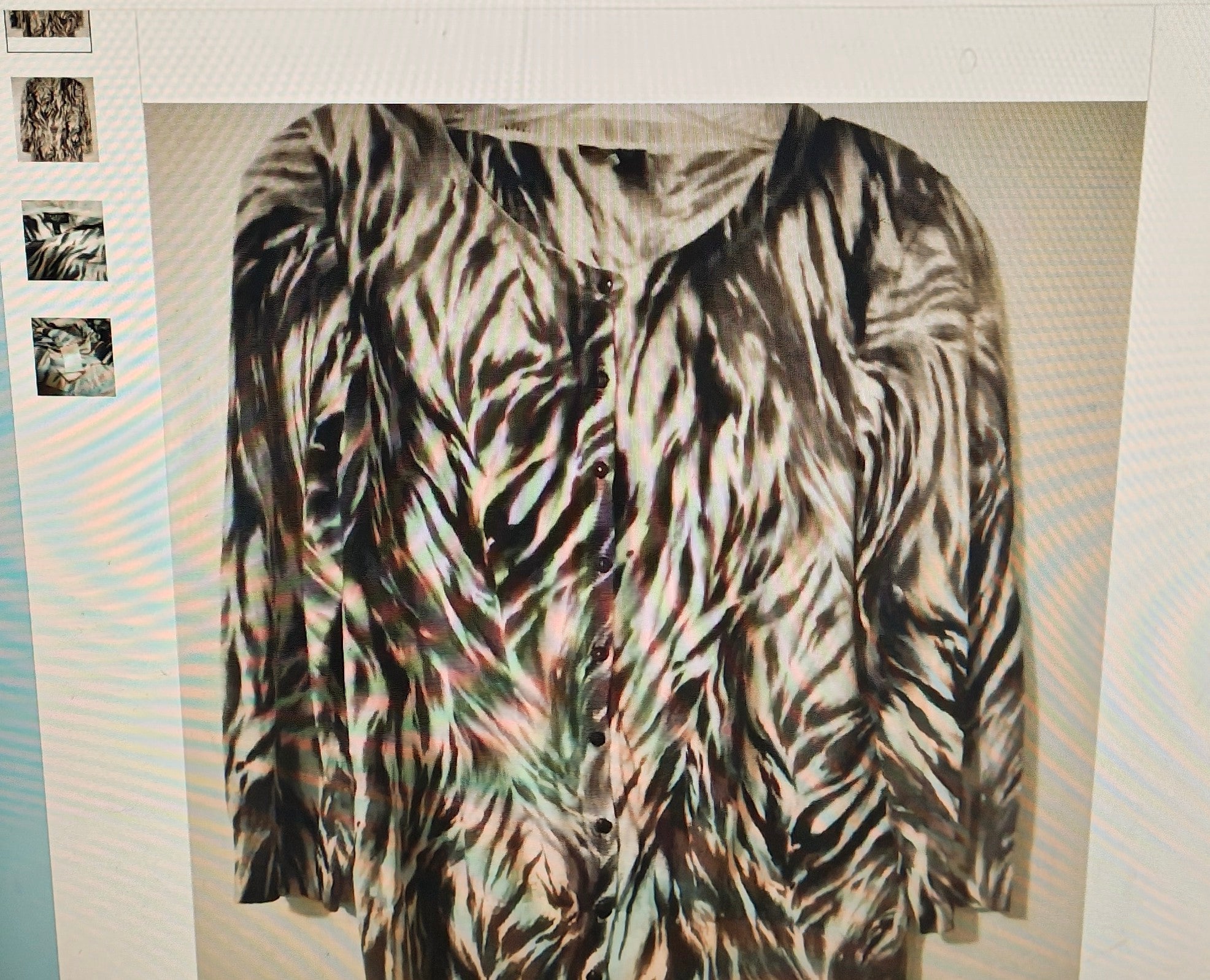 Zebra print jacket on a mannequin against a white background