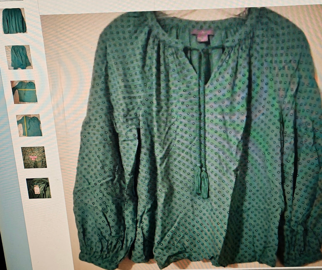 Green patterned blouse on a light background