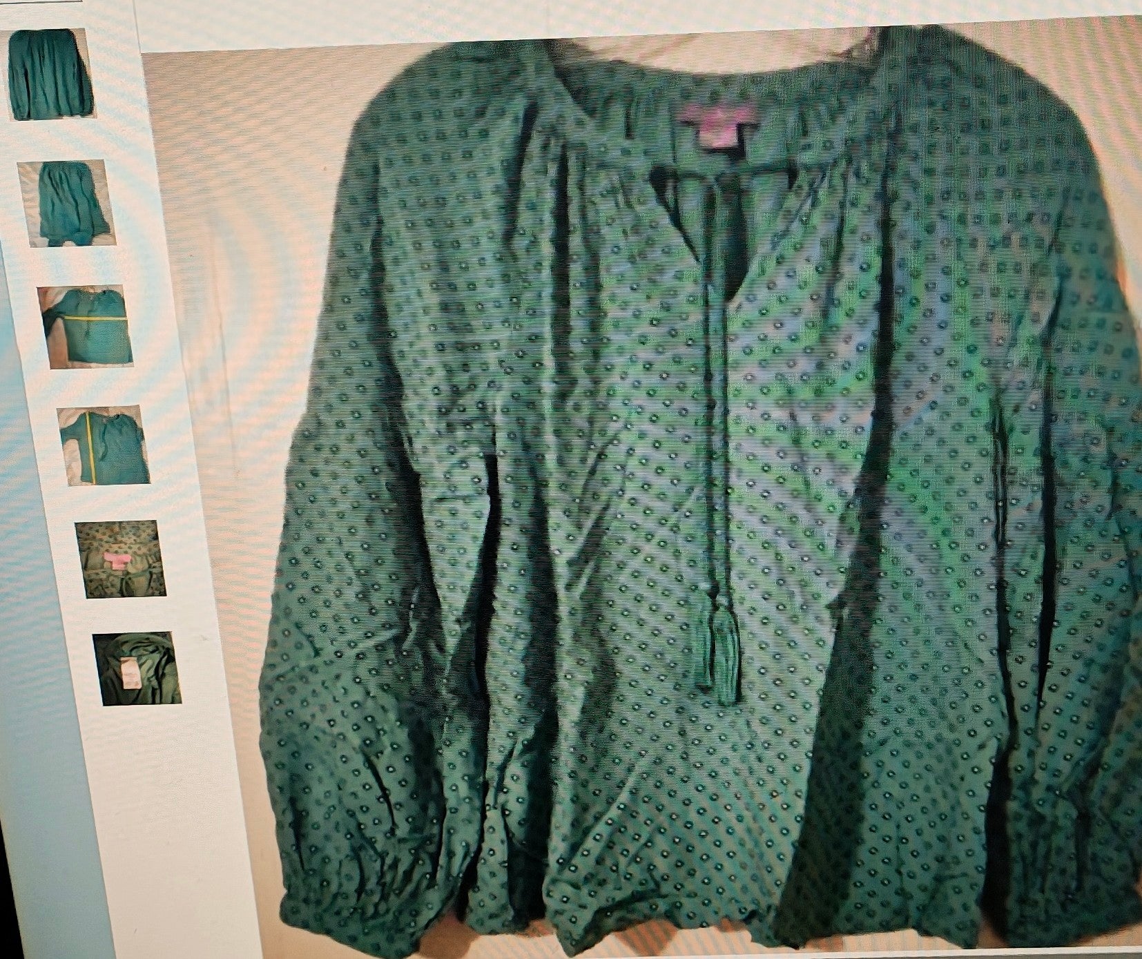 Green patterned blouse on a light background