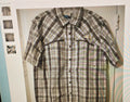 Plaid shirt with short sleeves on a light background
