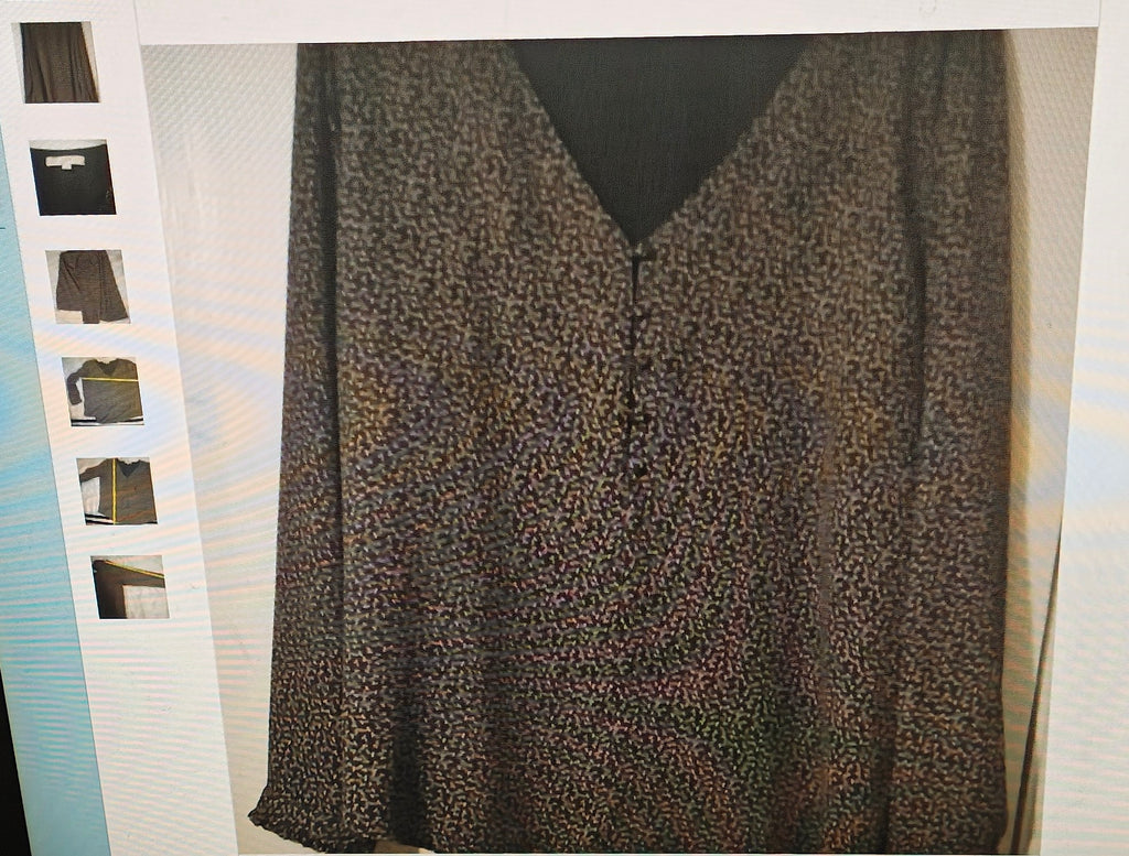 Leopard print dress with a black V-neckline on a white background