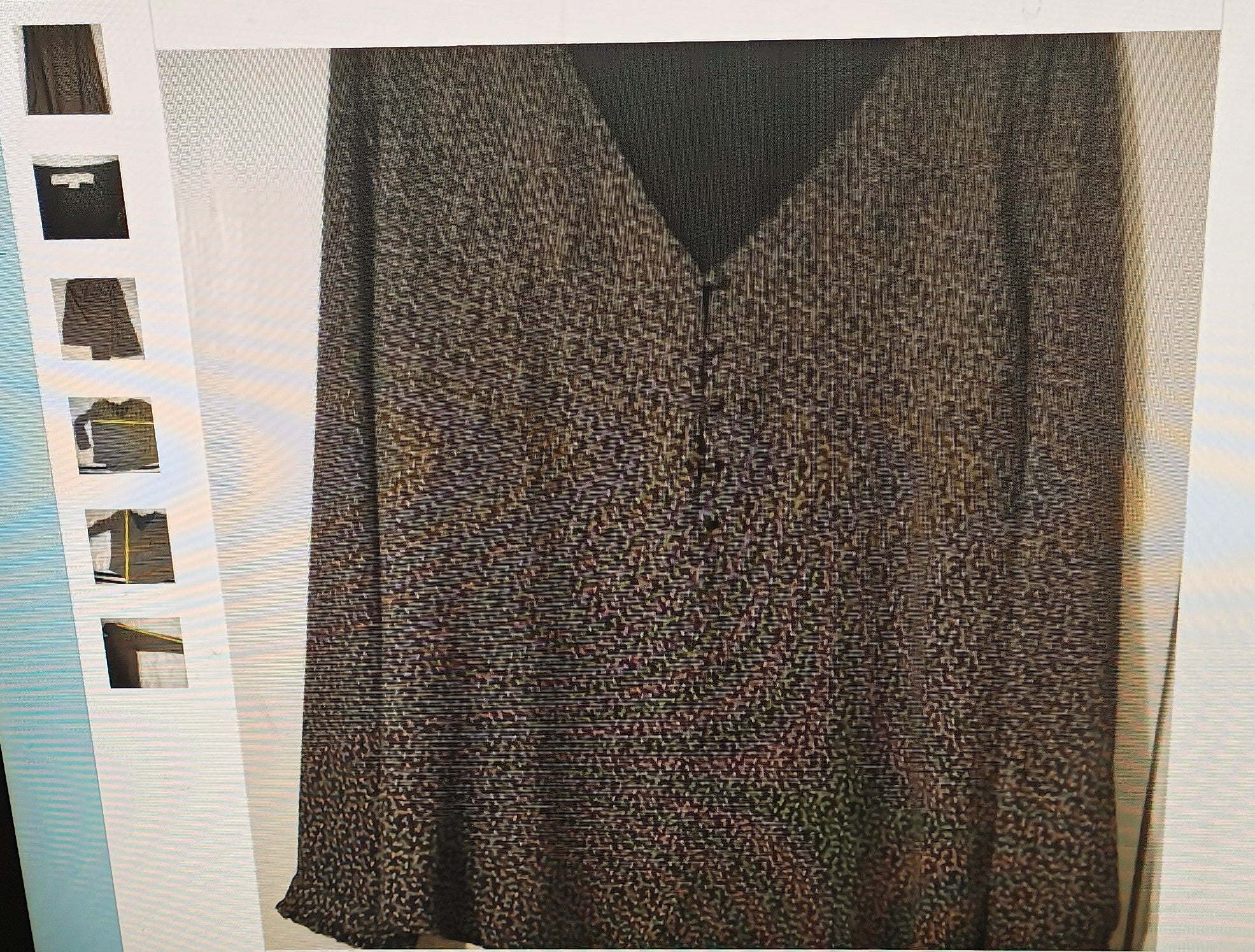 Leopard print dress with a black V-neckline on a white background