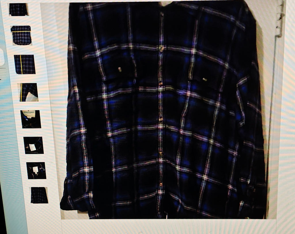 Plaid shirt on a hanger with a film strip background