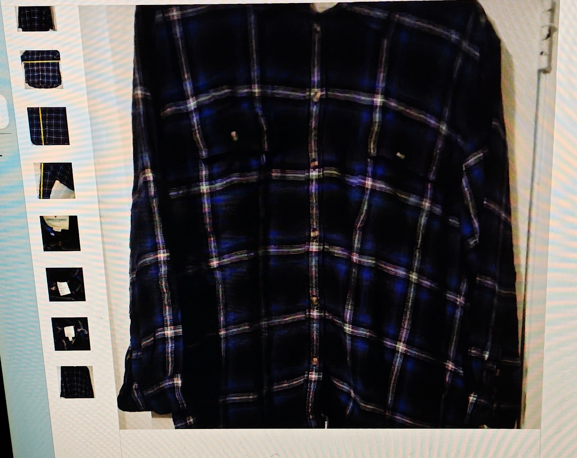 Plaid shirt on a hanger with a film strip background