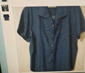 Blue shirt on a hanger against a neutral background