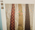 Three patterned ties displayed on a white background