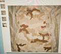 Camouflage pattern on a fabric with a close-up of the texture.