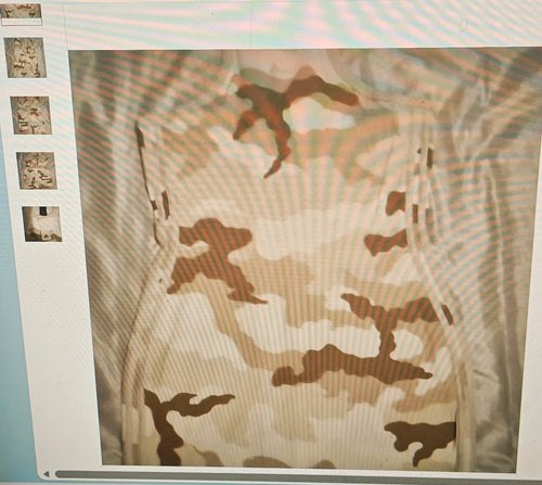 Camouflage pattern on a fabric with a close-up of the texture.