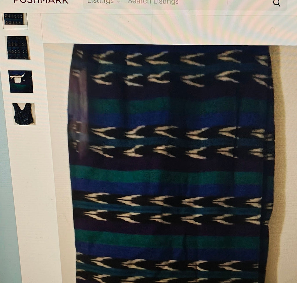 Patterned skirt with blue and black design on a white background