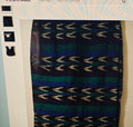 Patterned skirt with blue and black design on a white background