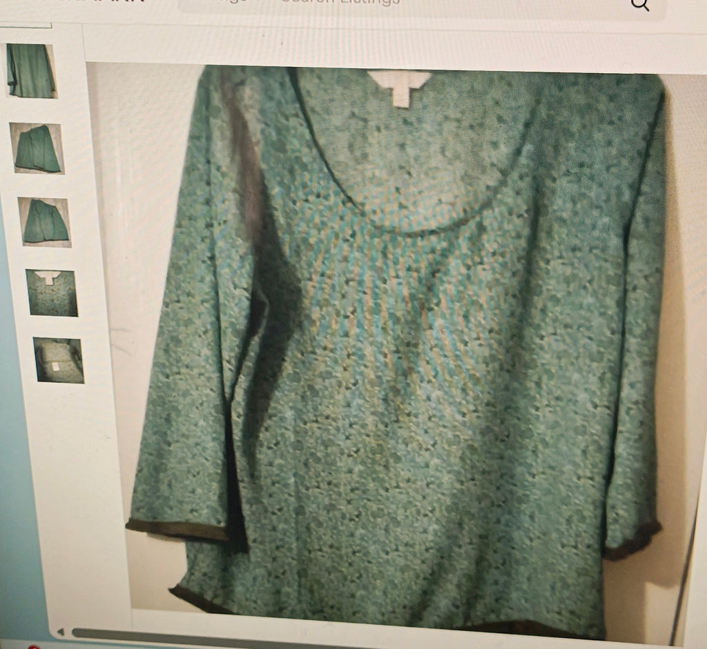 Green patterned top on a light gray background