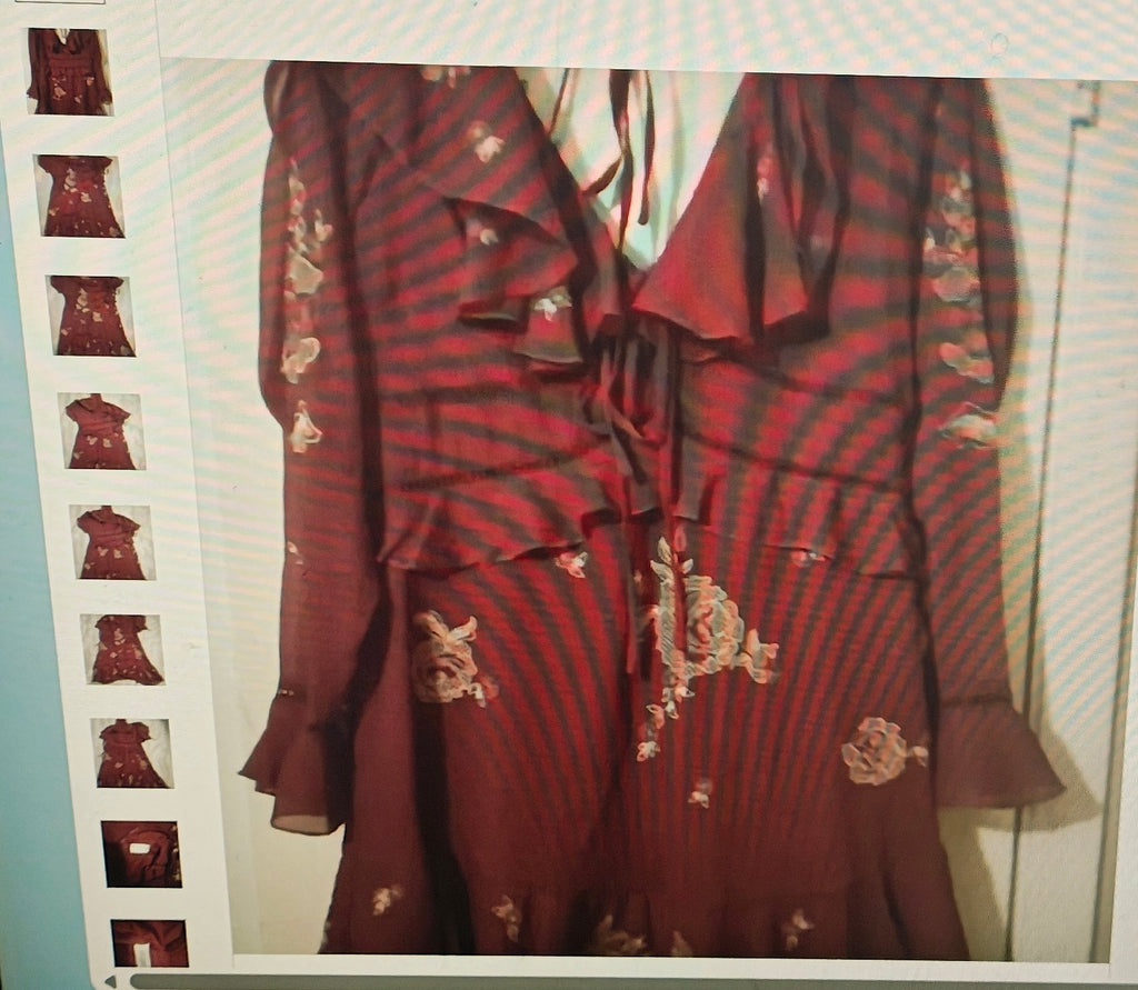 Red floral outfit displayed on a rack with smaller images below.