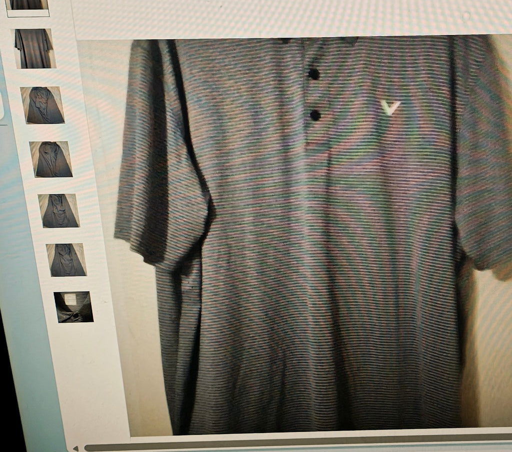Striped polo shirt on a hanger with a blurred background