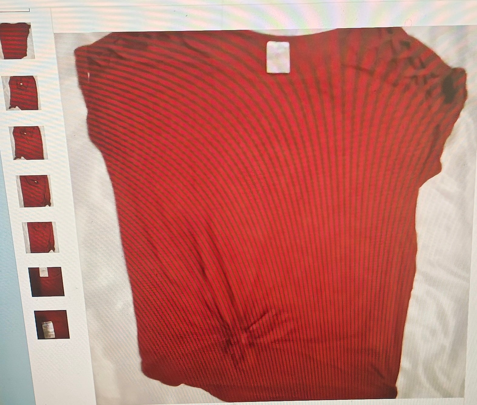 Red ribbed sweater on a white background