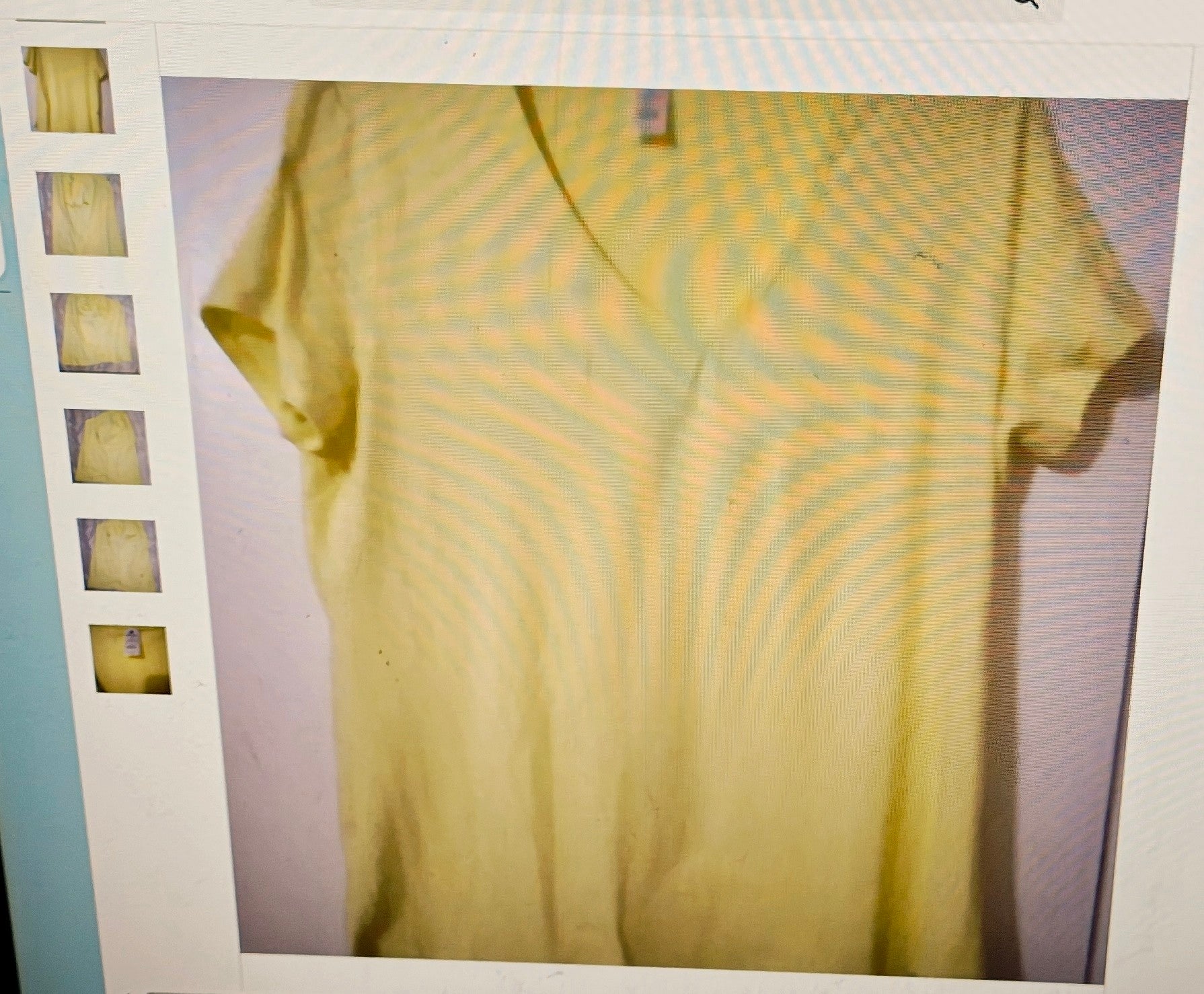 Yellow t-shirt on a light purple background with a white border
