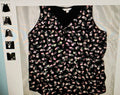 Floral-patterned sleeveless top on a light gray background