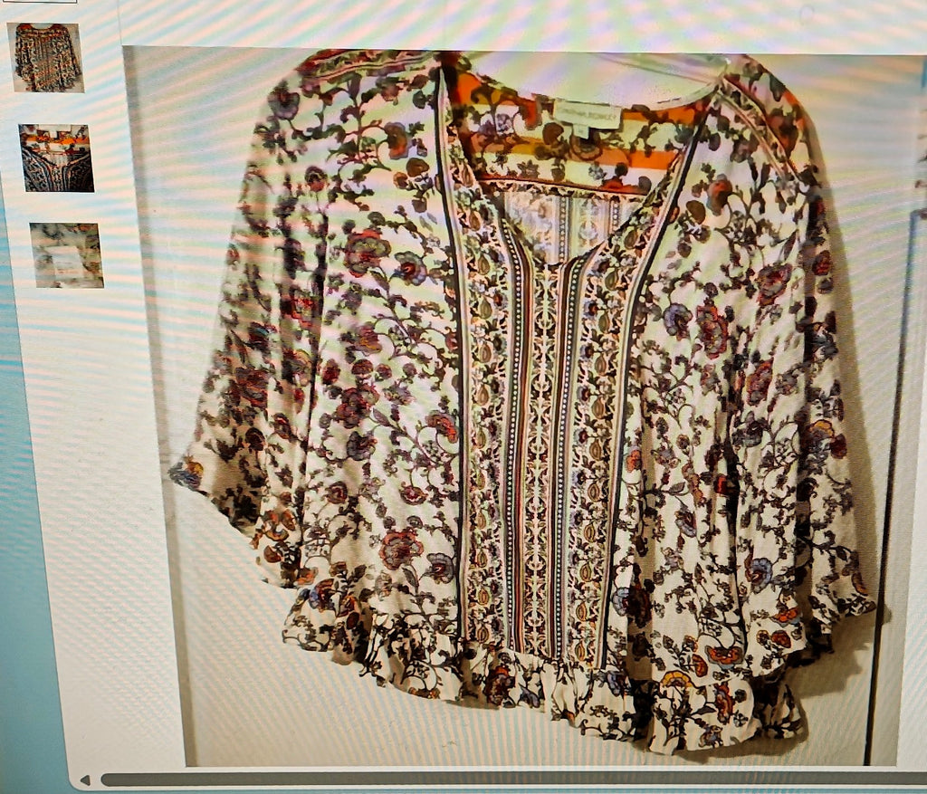 Floral patterned blouse on a light background