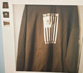 Brown sweatshirt with a graphic design on a white background