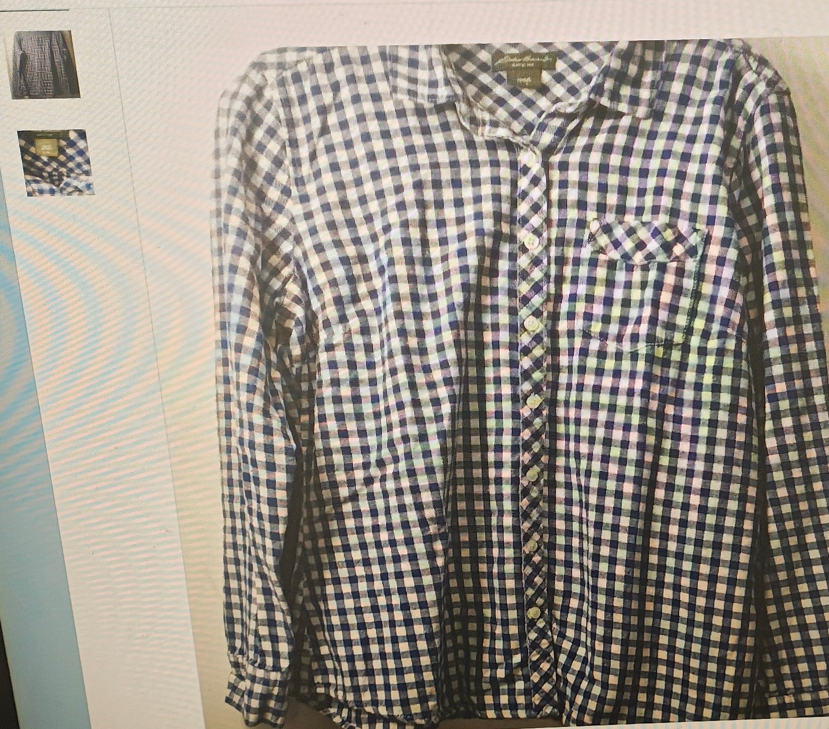 Blue and white checkered shirt on a plain background