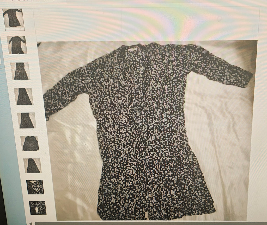 Black floral dress on a white background with a rainbow reflection