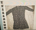 Black floral dress on a white background with a rainbow reflection