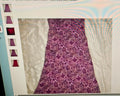 Close-up of a purple floral dress fabric with a computer interface overlay.