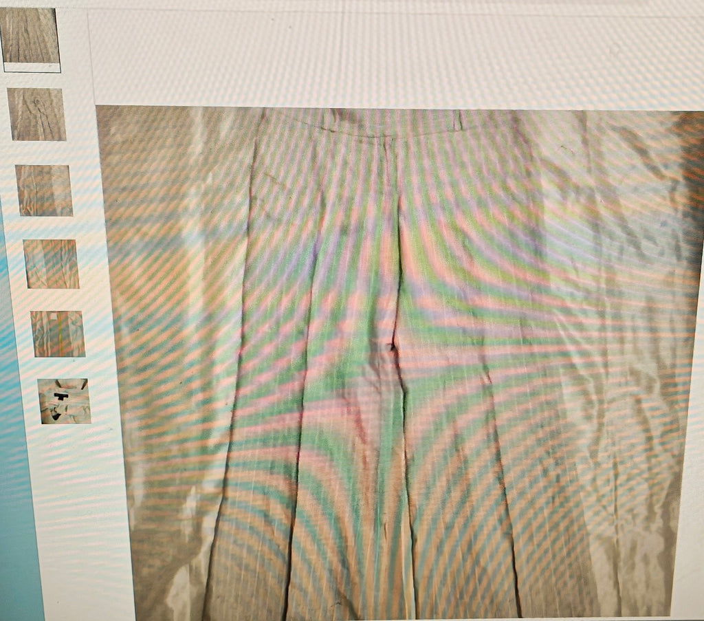 Plaid fabric with a pattern of brown, green, and pink on a white background.