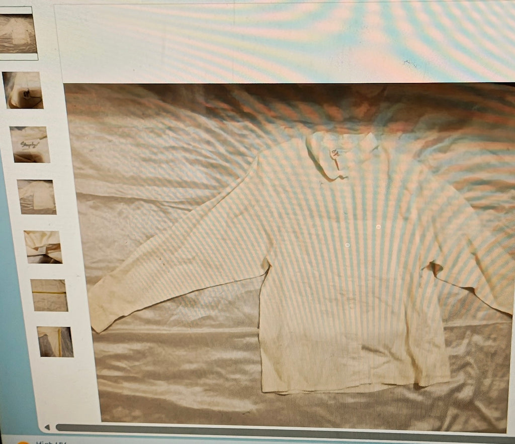 Beige long-sleeve shirt on a light gray background