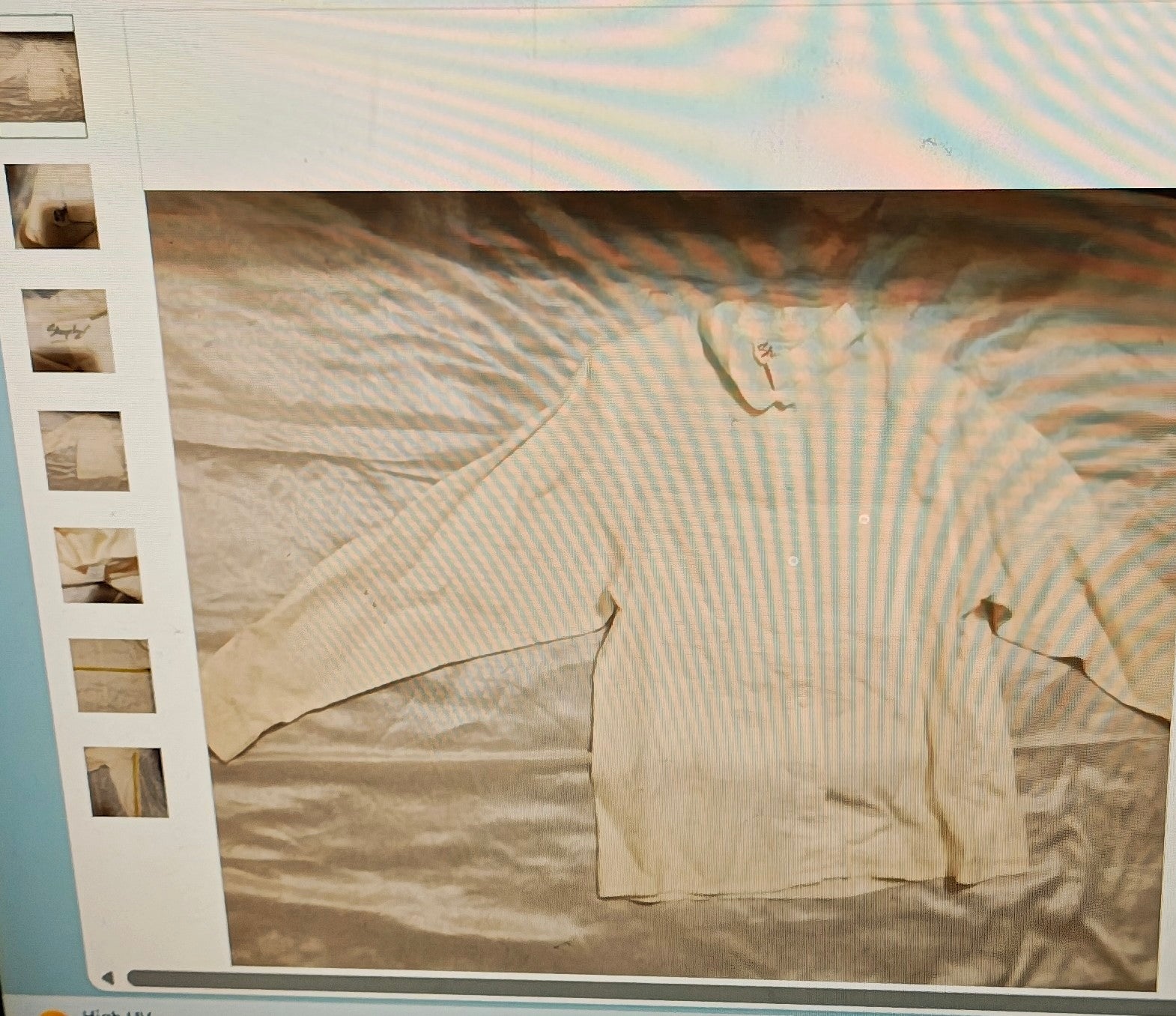 Beige long-sleeve shirt on a light gray background