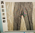 Close-up of a patterned fabric with a film strip border on a computer screen.