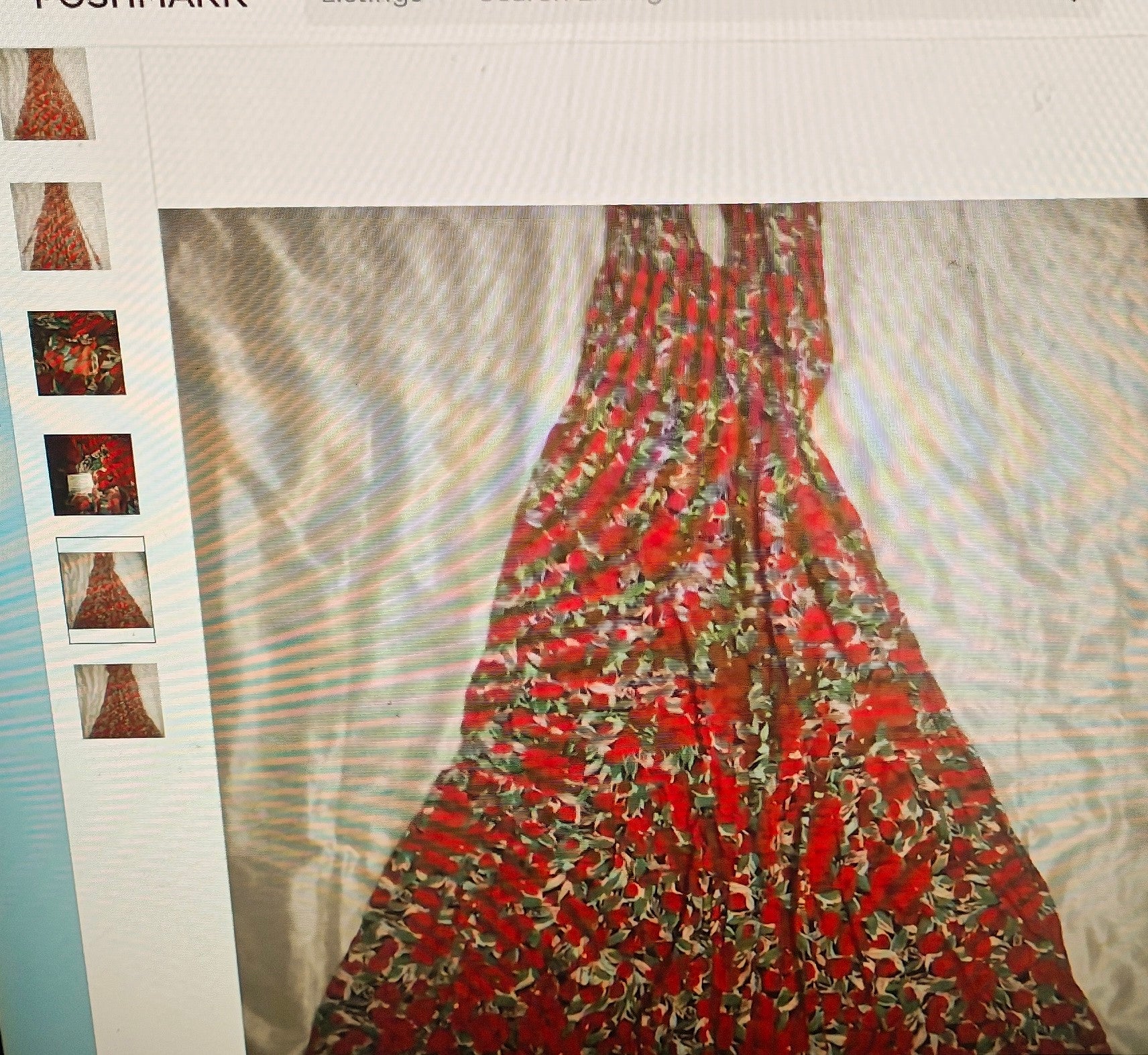 Red floral dress on a white background with Pinterest app interface.
