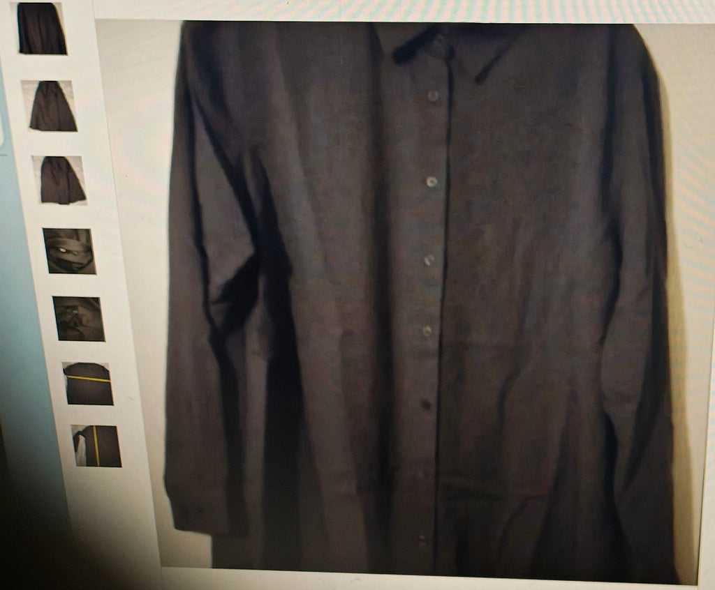 Dark gray button-up shirt on a hanger with a white background