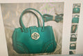 Women's turquoise faux leather bag with handle and strap with gold tone metal
