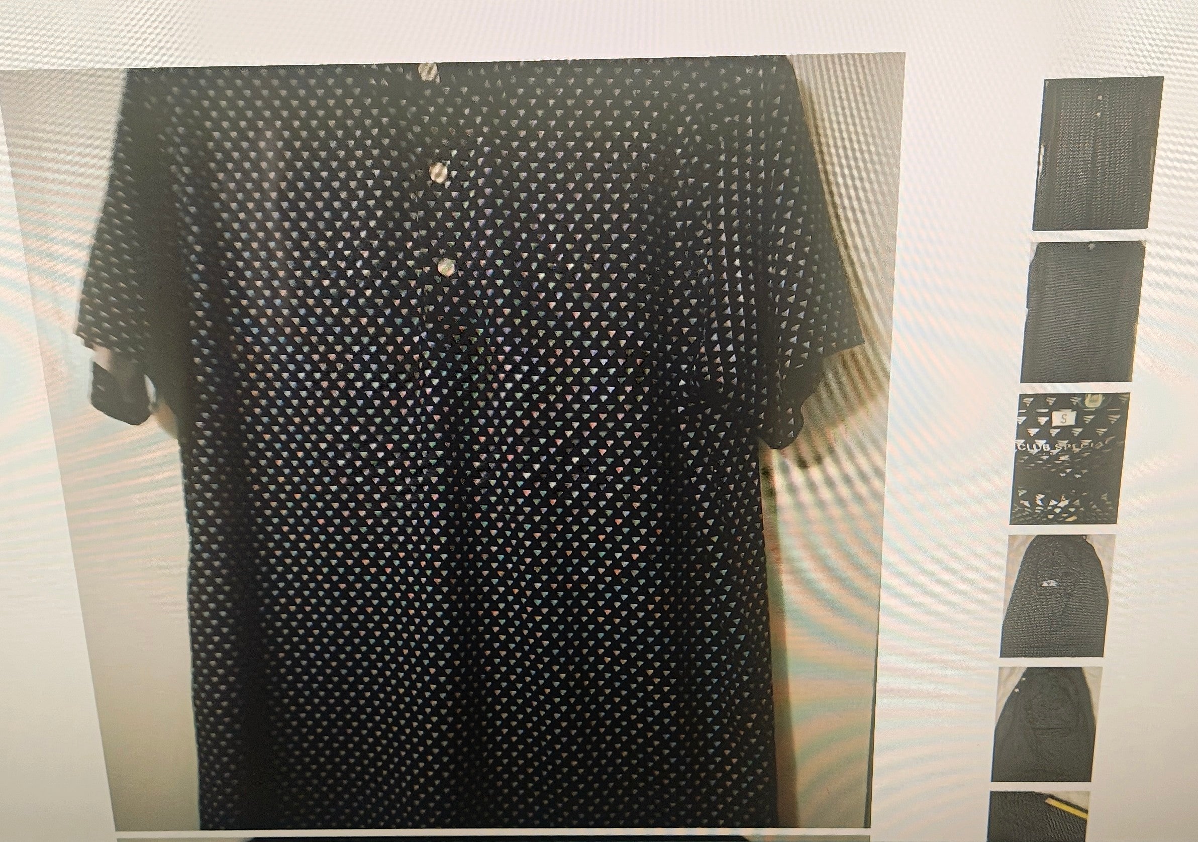A black short-sleeve button-up shirt with a small white geometric pattern, shown hanging against a light-colored wall. A vertical strip of six thumbnail images is visible on the right side of the frame.