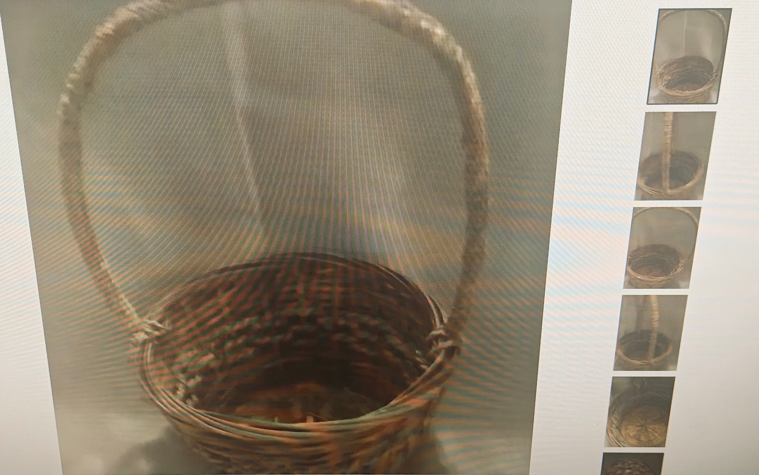 A woven wicker basket with a tall loop handle, shown against a gray background with a narrow vertical strip of smaller inset images on the right.