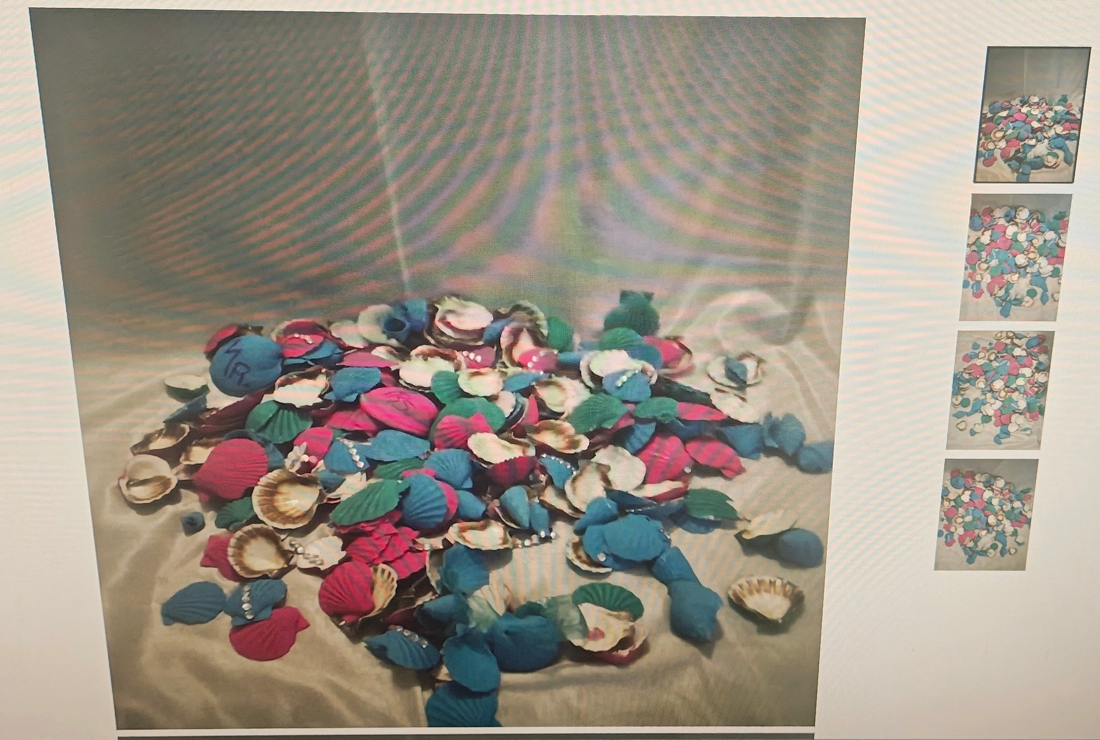 A pile of colorful seashell-shaped accessories in blue, pink, purple, and white, arranged on a light fabric surface with a small vertical strip of four smaller thumbnail images on the right.