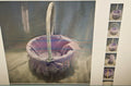 A woven basket with a white rope handle, lined in pink and purple striped fabric with a ruffled hem and bow, shown against a gray backdrop. A vertical strip of five smaller thumbnail images appears along the right side.